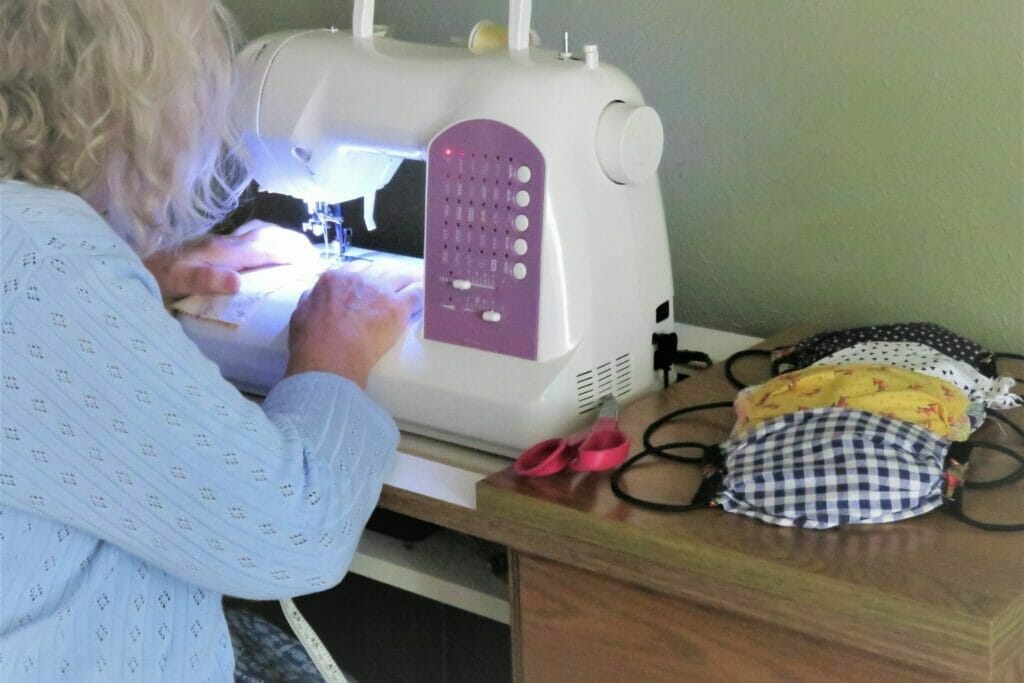 Senior sewing masks during COVID-19